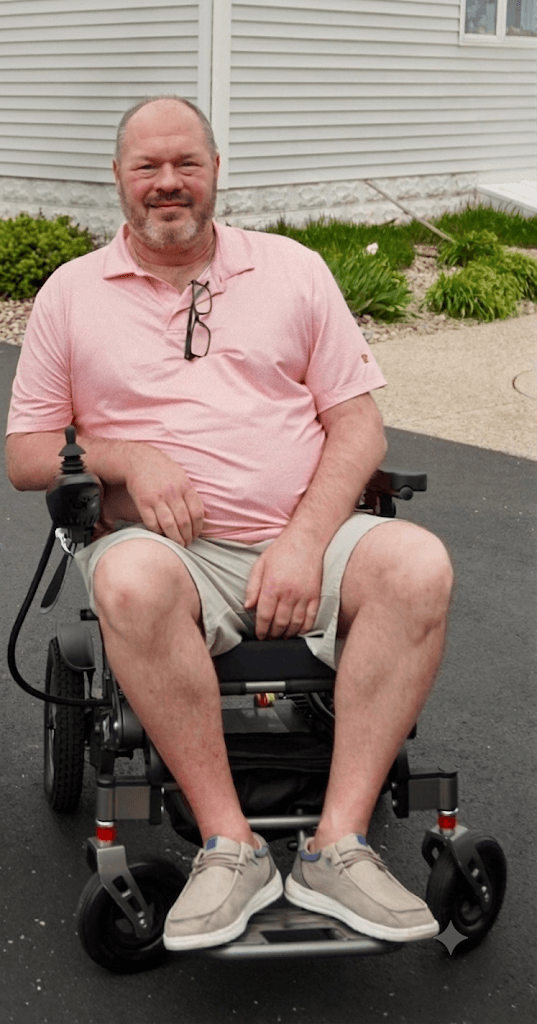 Shawn Colin outdoors in his power wheelchair